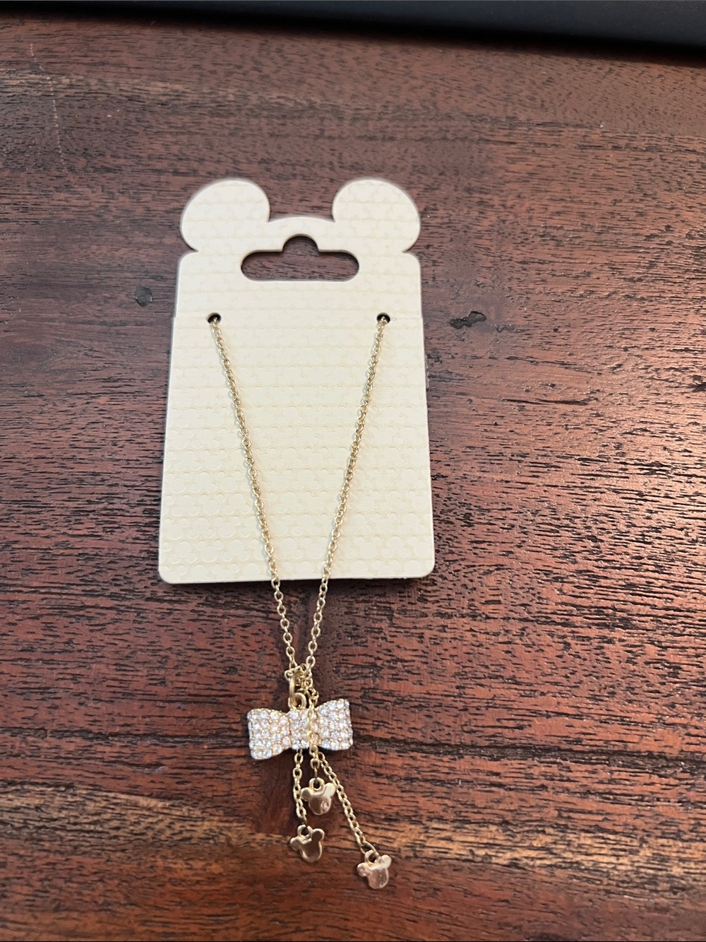 Disney Gold Bow Necklace with Clear Crystal Accents. NWT